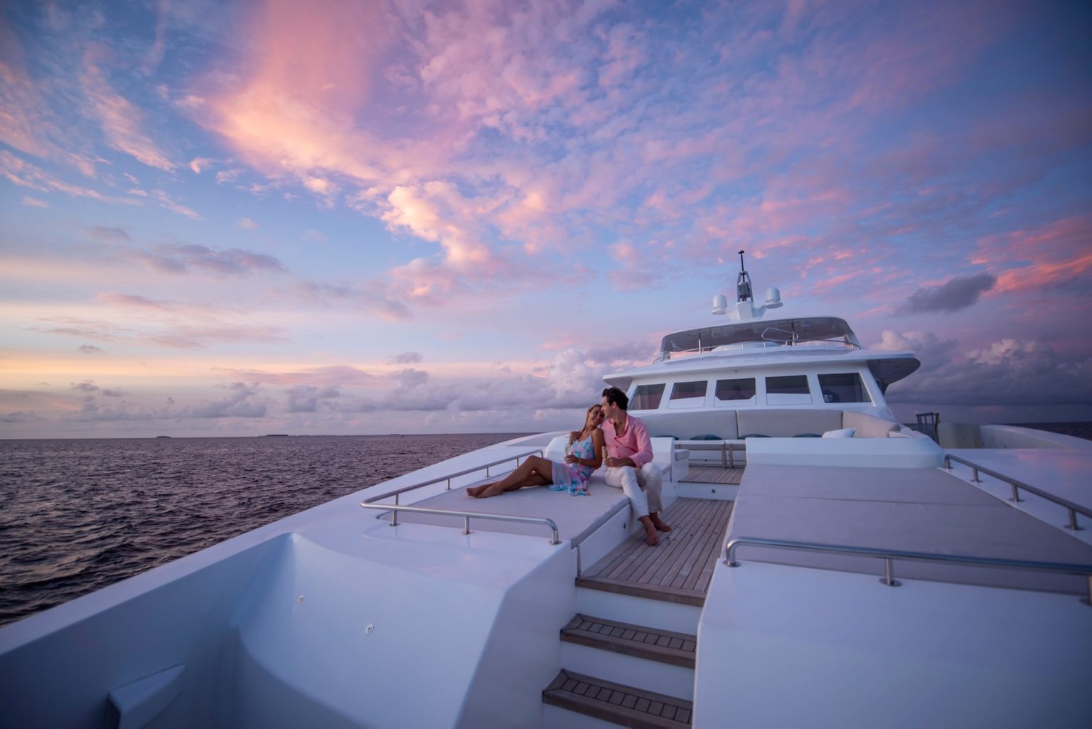 Guests on the bow at sunset